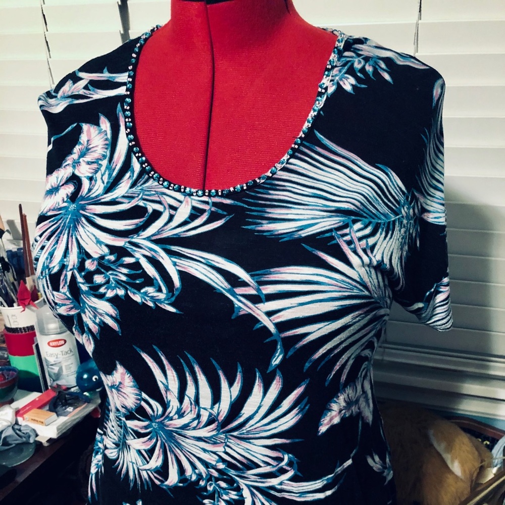 Cute blouse with beaded neckline